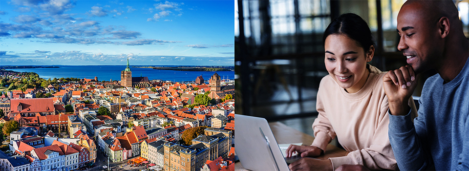 Stadt am Meer; Paar am Laptop